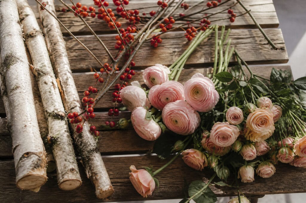 Alternative branches and flowers styled as substitutes for a tabletop tree build