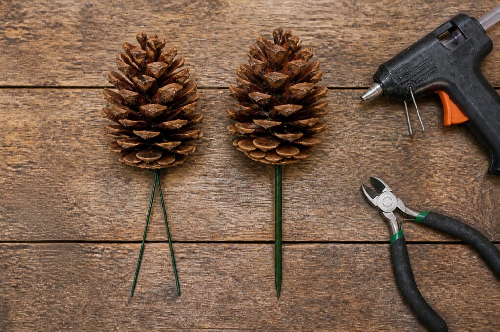 Wired and hot-glued pinecones prepared for a holiday floral arrangement