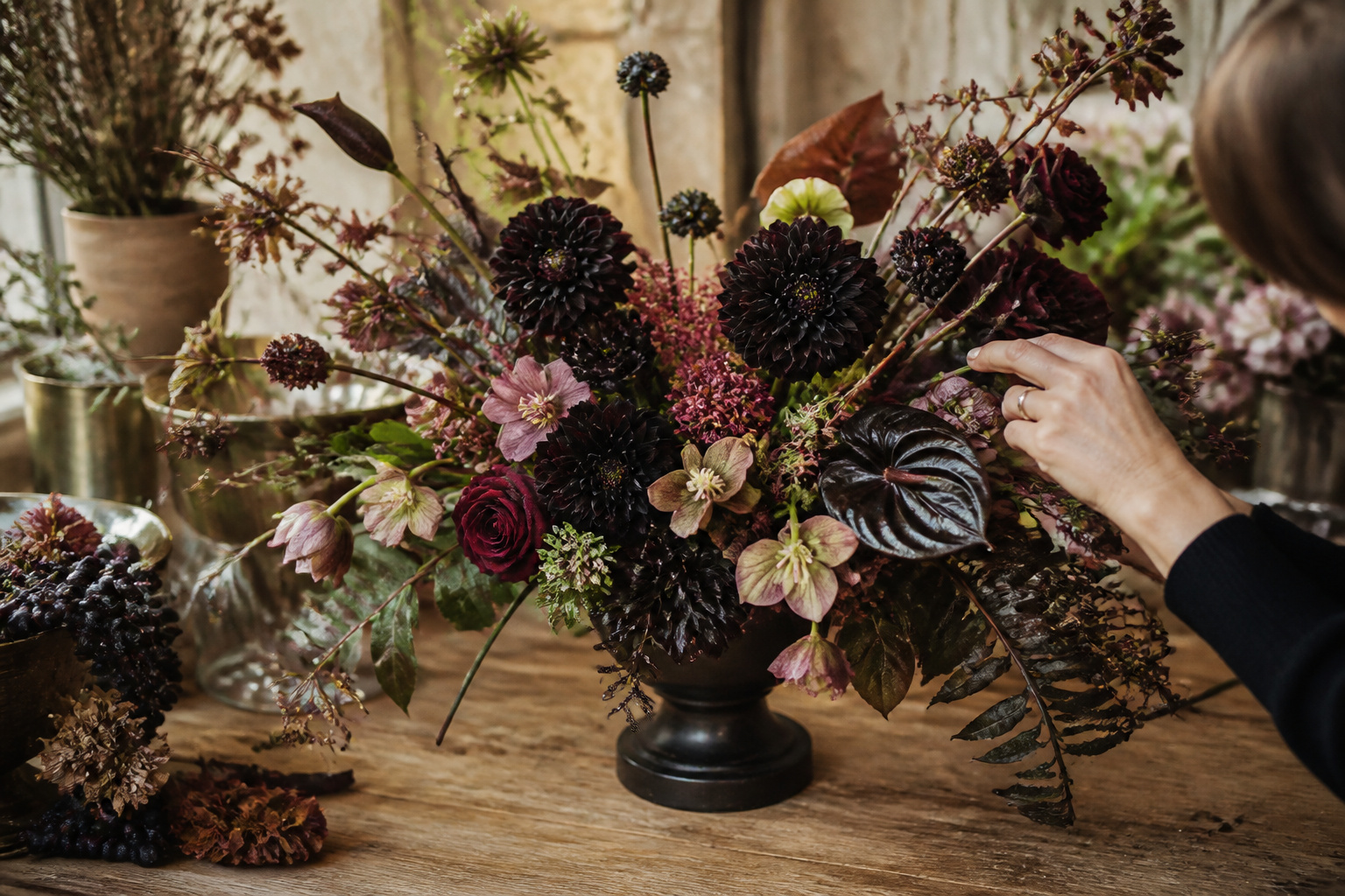 Elaborate custom Halloween flower arrangement with black dahlias and layered textures